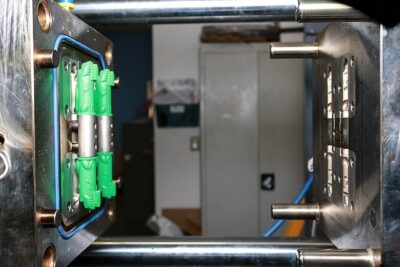 Green-Baby-Toothbrush-Toy-in-Molding-Machine-400x267