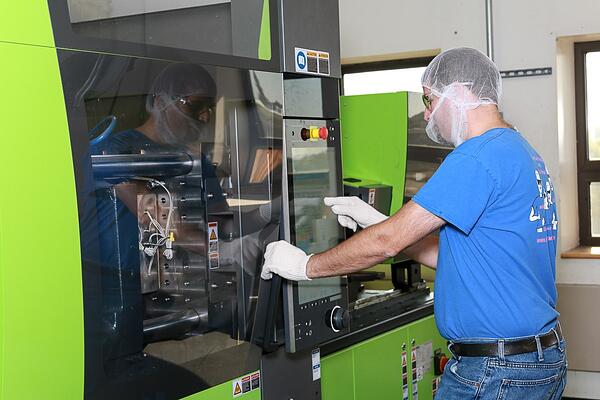 Extreme Molding employee producing cost-effective injection molding products